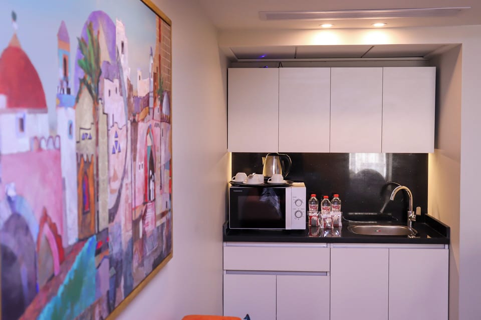 Quadruple Family Suite | Private kitchen | Full-size fridge, coffee/tea maker