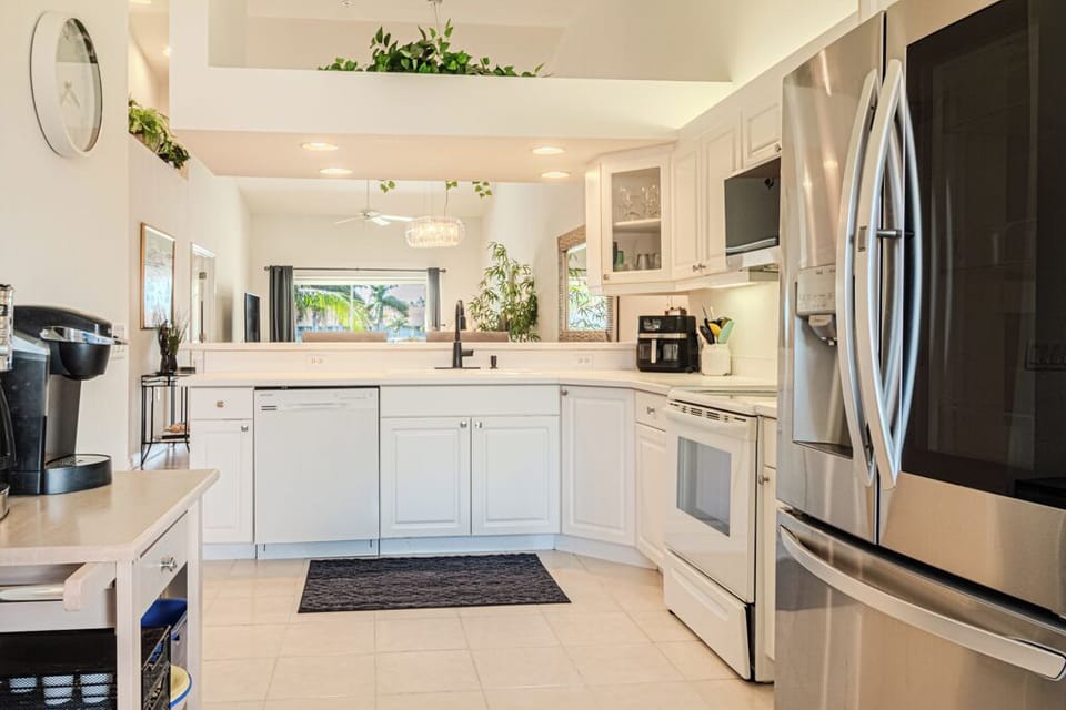 Open-layout kitchen with plenty of counter space ideal for preparing meals.