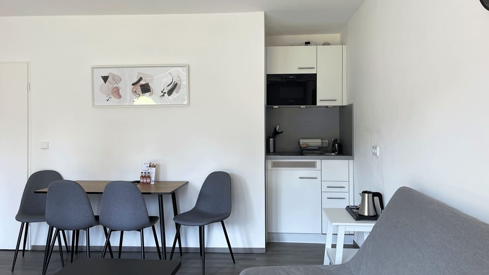 Basic Suite, 1 Bedroom | Private kitchen | Full-size fridge, microwave, stovetop, toaster