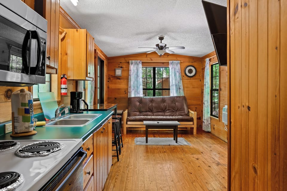 Open-plan cabin with a fully stocked kitchen—meals made easy, memories made forever.