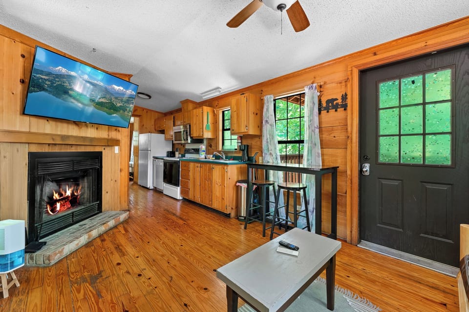 Stretch out and relax—warm tones, wood beams, and fireplace charm await.