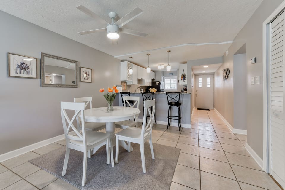 Dining area - Dining table and kitchen island bar, can fit up to 7 people. Ocean view, poolside condo, Cocoa Beach, FL
