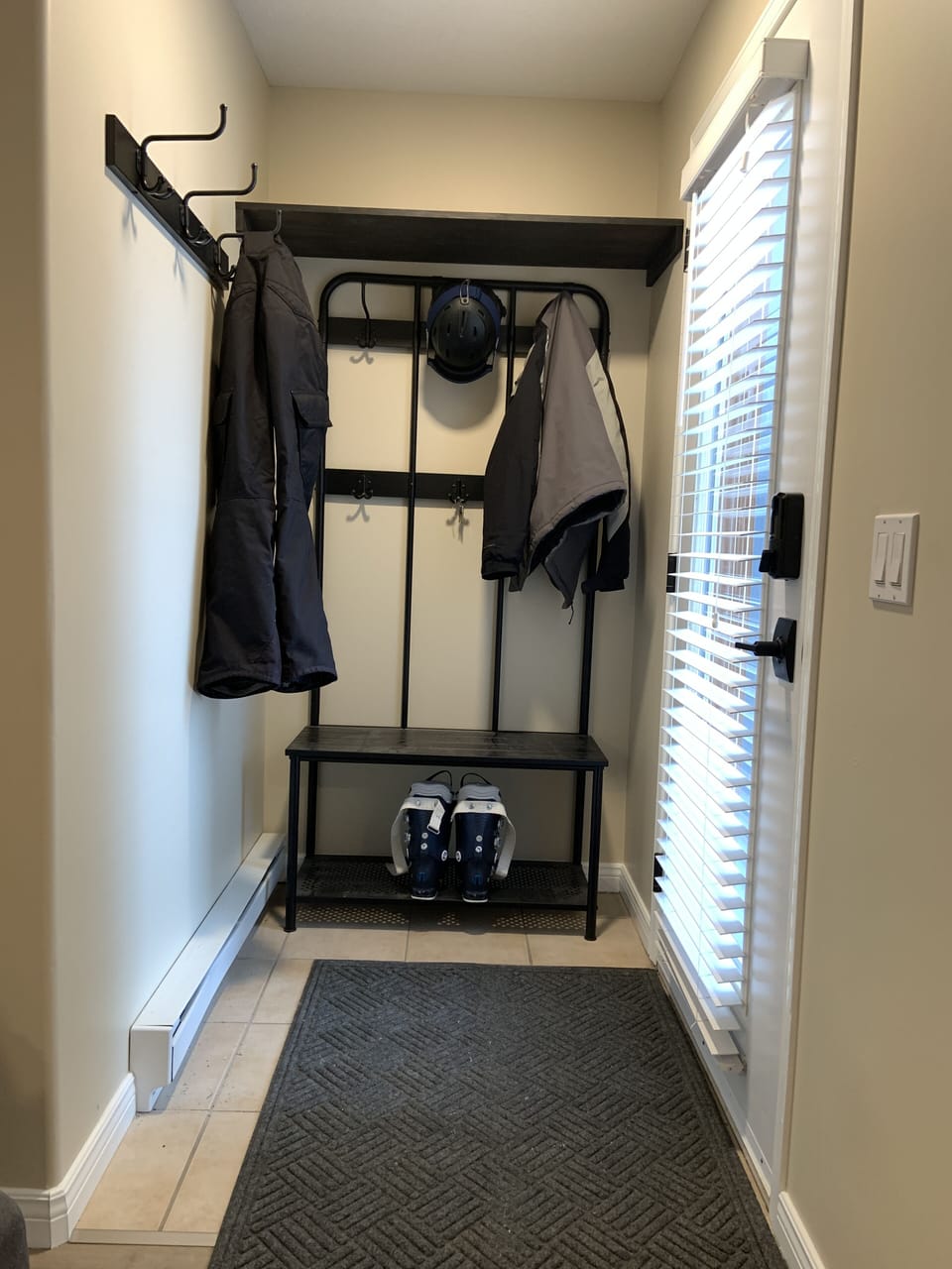 Nook behind front door for ski gear