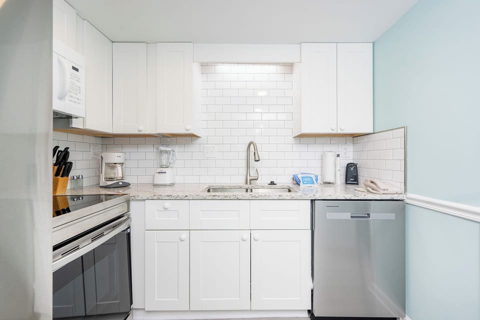 Craft memorable family moments while preparing meals in this inviting kitchen, designed for your coastal getaway