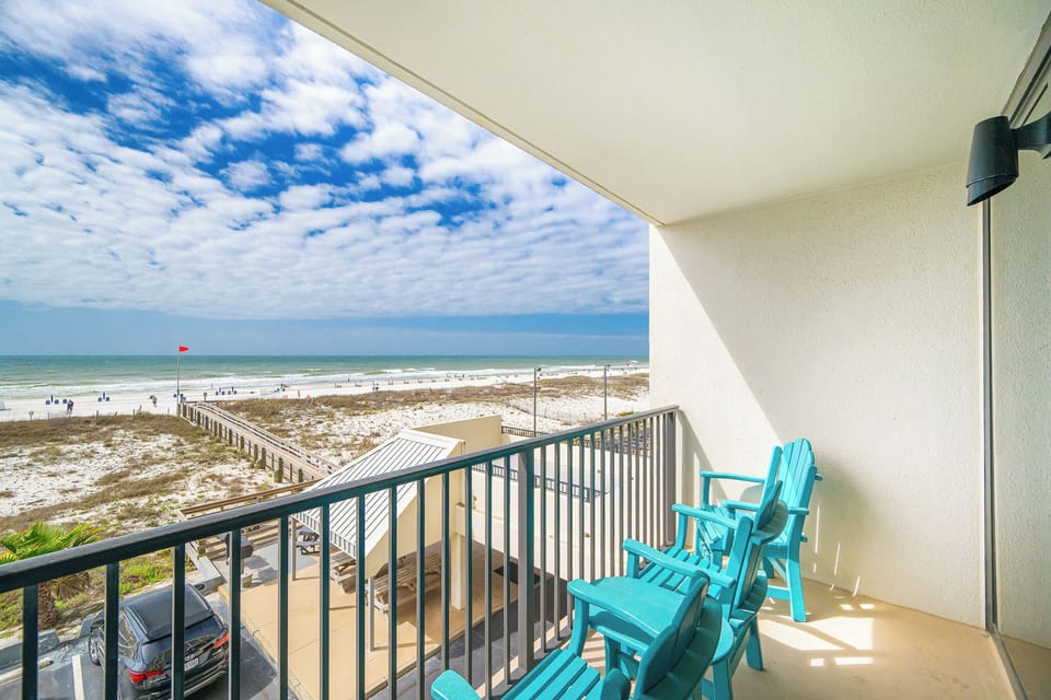 Relax in your chairs and soak in the vibrant vibes of the coast while enjoying the stunning views from your balcony