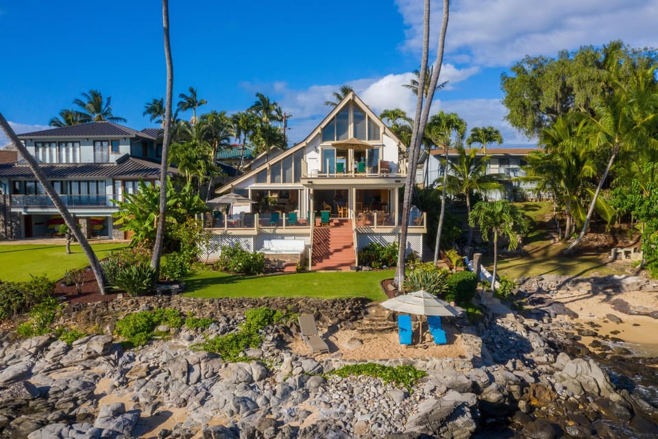 Sandy cove out front with a large umbrella for those that prefer shade