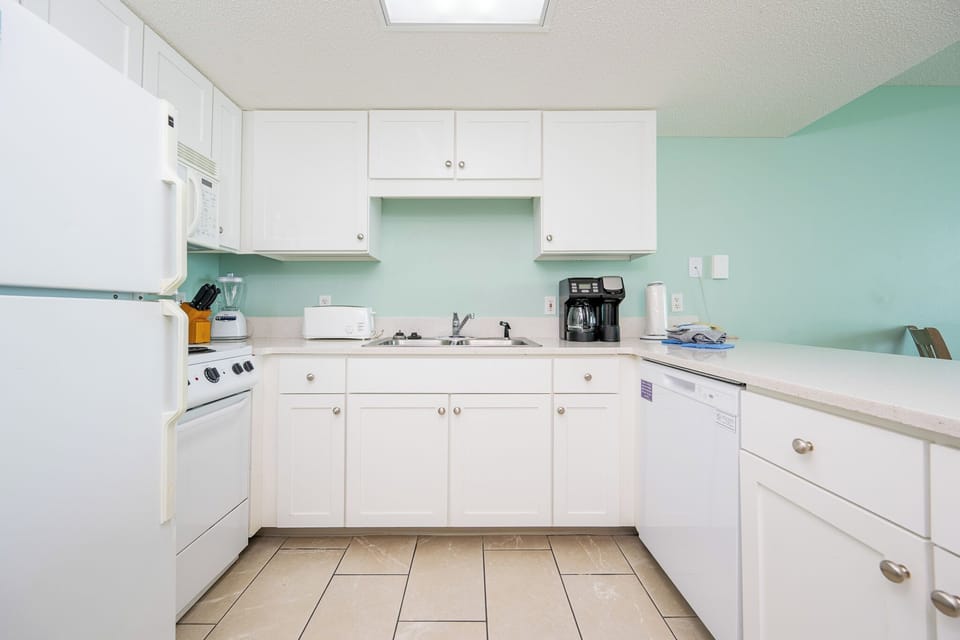 Discover a hotel kitchen that transforms your beach retreat into ultimate convenience, just like home
