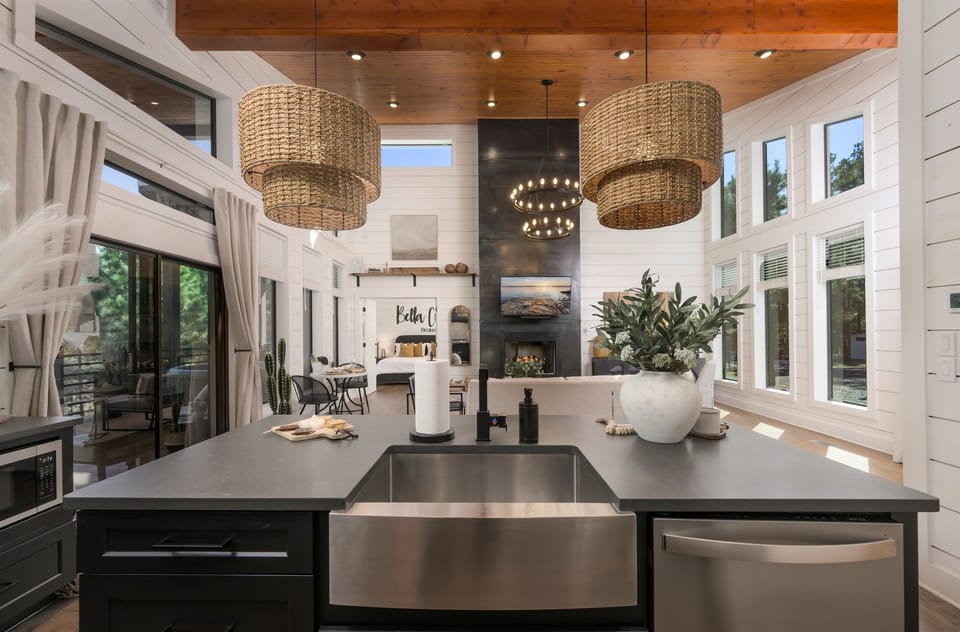 The heart of the home—an open-concept kitchen where modern design meets cozy cabin warmth