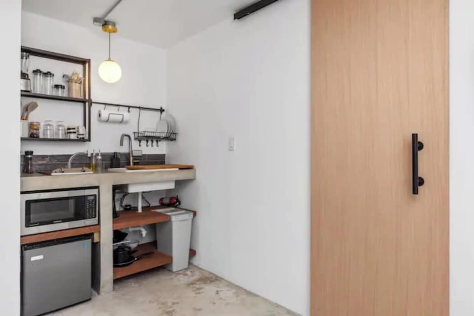 The kitchenette is equipped with all the necessary essentials to make a quick meal