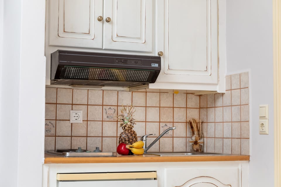 Mini-fridge, stovetop, electric kettle, cookware/dishes/utensils