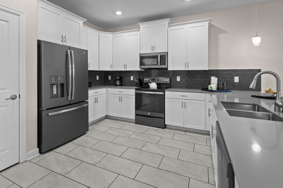 Your spacious kitchen features modern appliances and elegant finishes, perfect for preparing meals during your stay.