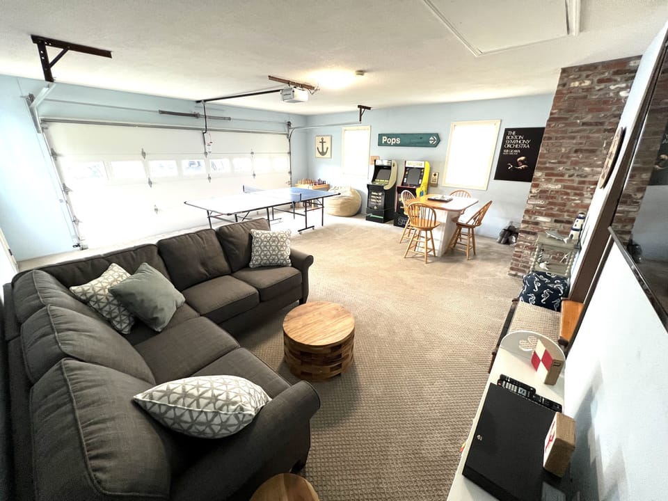 Rec room includes ping pong, arcade games, chess table, bar area and tv lounge