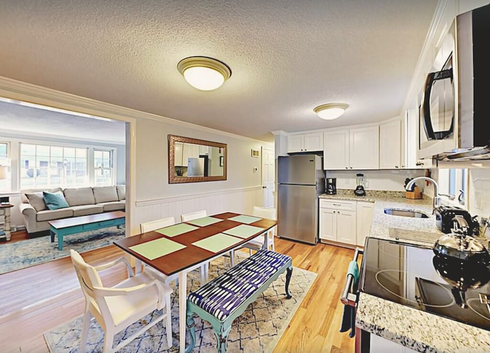 Full kitchen has granite counter tops and updated appliances. 