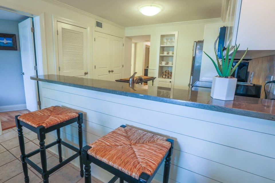 The doorway on the left side of this photo leads to the primary suite.