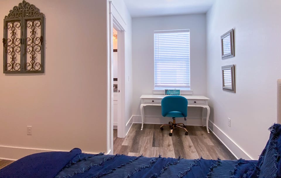 Two Queens, large 65" TV, desk  / office area. En suite bathroom /w shower stall