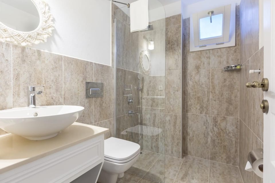 Shower, hair dryer, slippers, towels