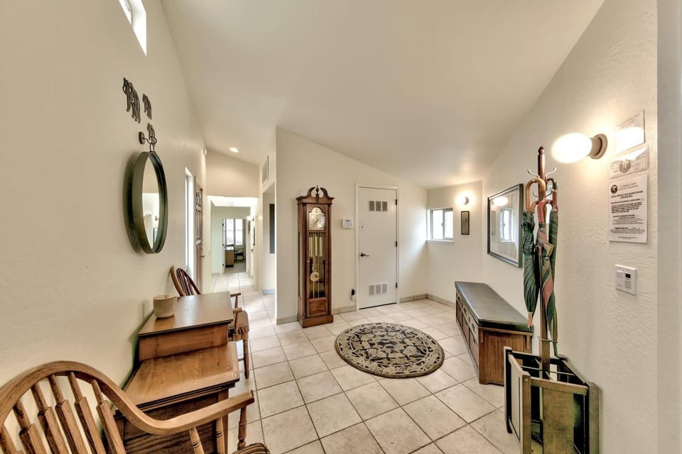 Step into your welcoming foyer where classic charm meets modern comfort, featuring elegant furnishings and thoughtful touches for your perfect mountain retreat.