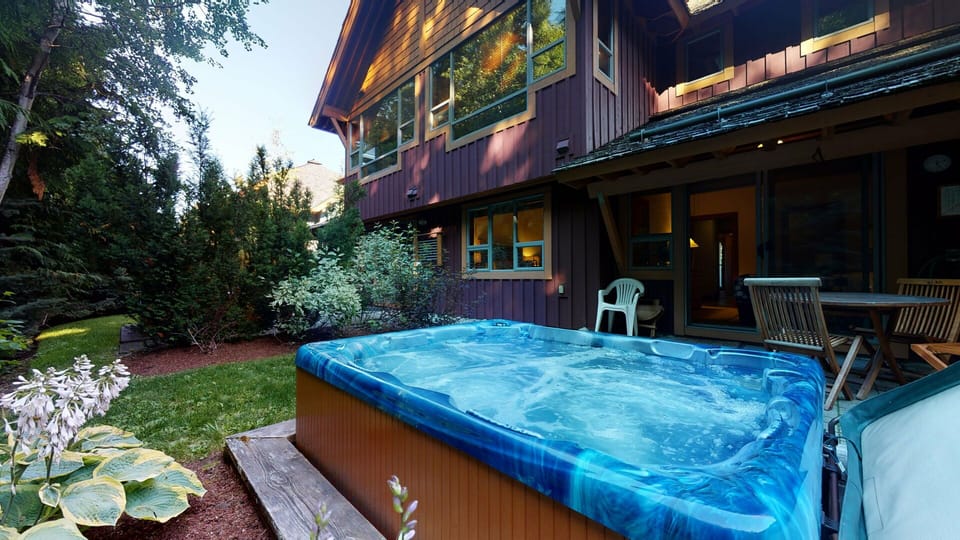 Soak in your private hot tub surrounded by towering trees and mountain air.