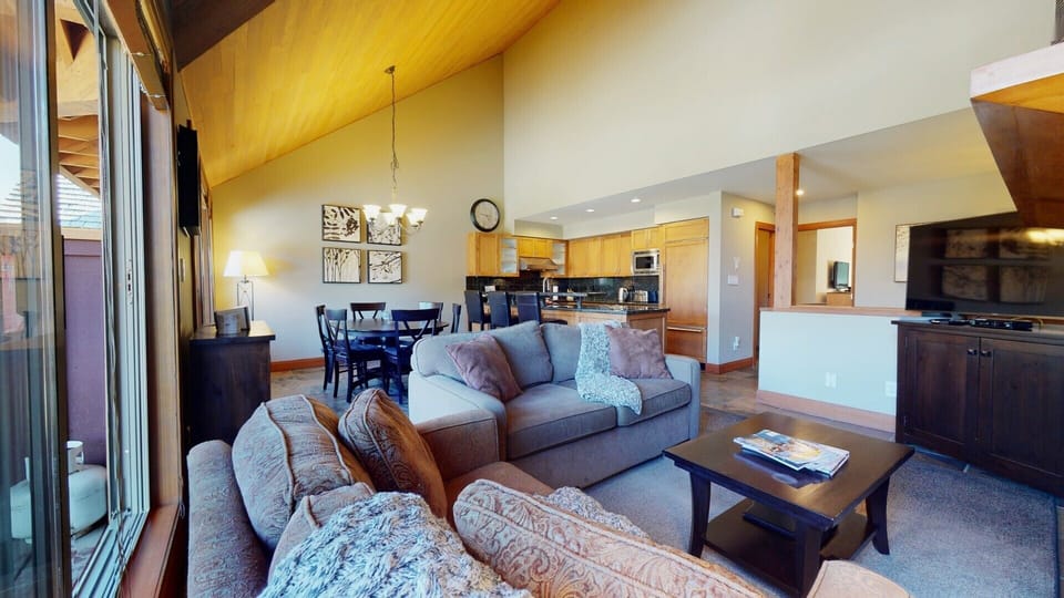 Relax by the gas fireplace in a spacious, open-concept living area.