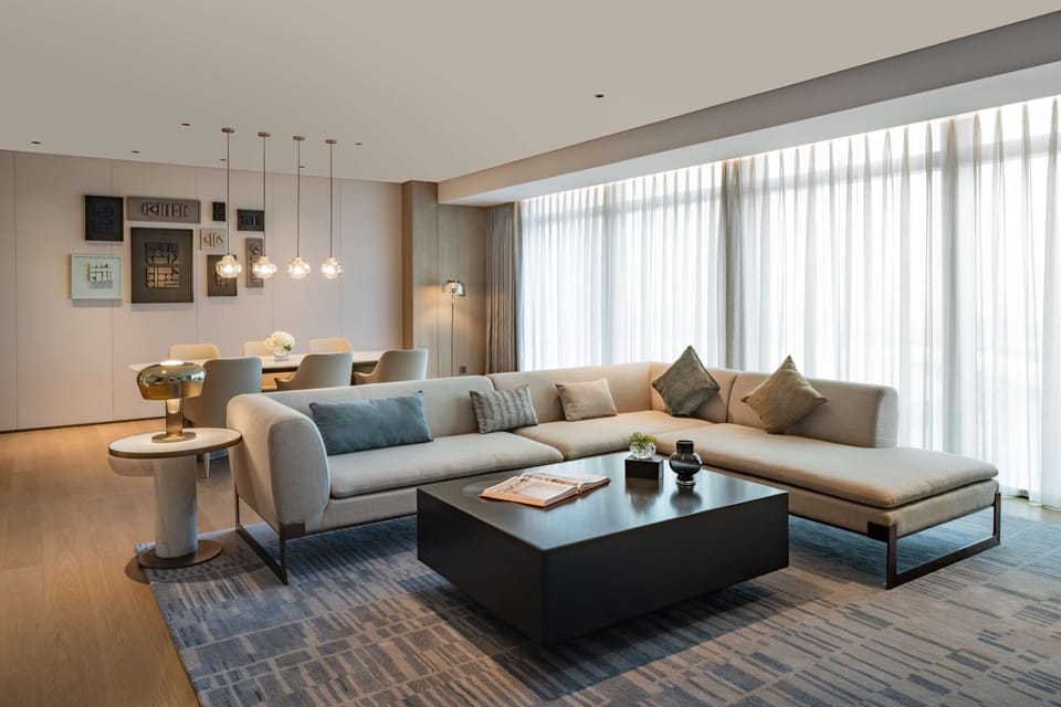 Deluxe Suite, 1 King Bed | Living area | 55-inch Smart TV with satellite channels, TV, pay movies