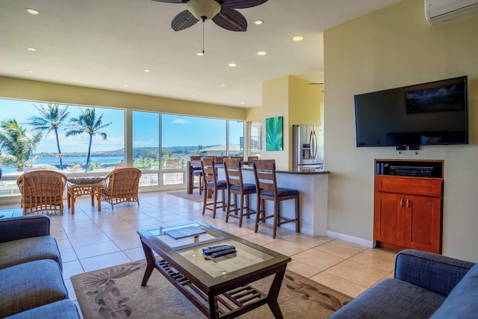 Stylish and serene, this living area invites you to unwind after a beach day with its cozy couch and open layout    