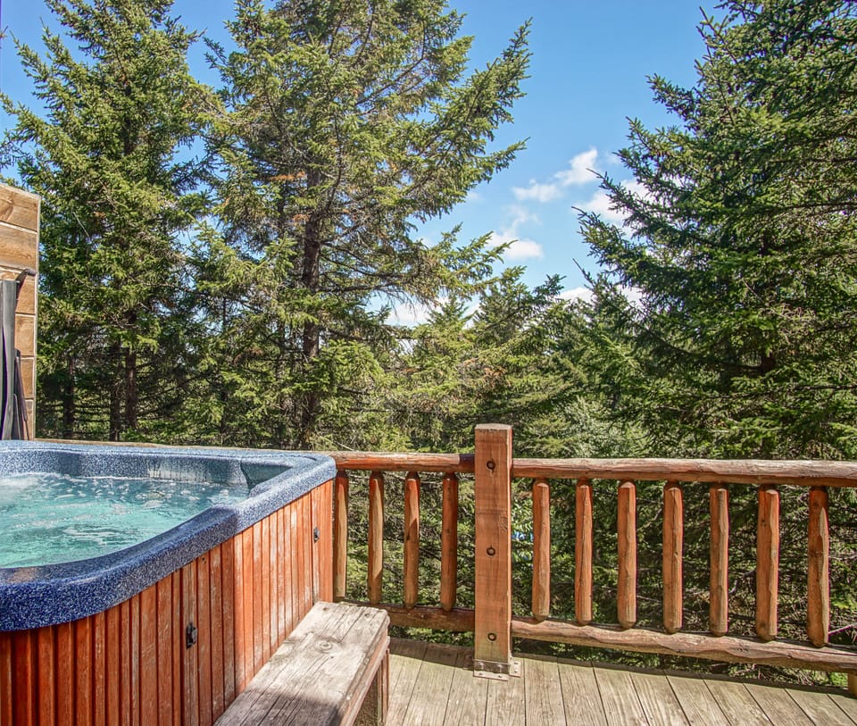 The hot tub is located on the 2nd floor balcony.