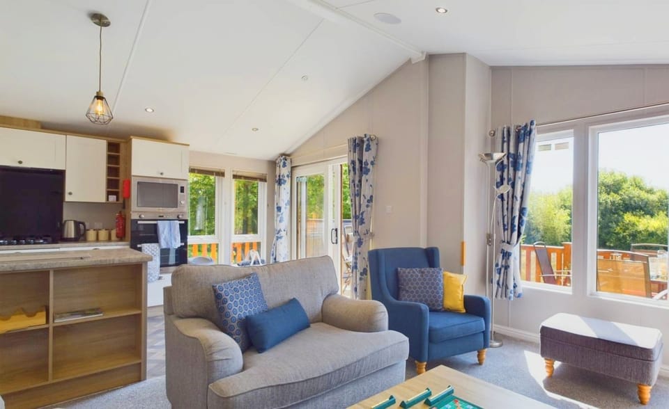 Open-plan kitchen and living area with lake views.