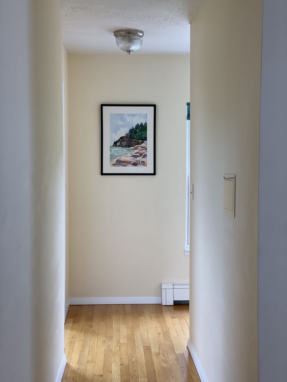 Hallway leading to 3rd bedroom suite and laundry