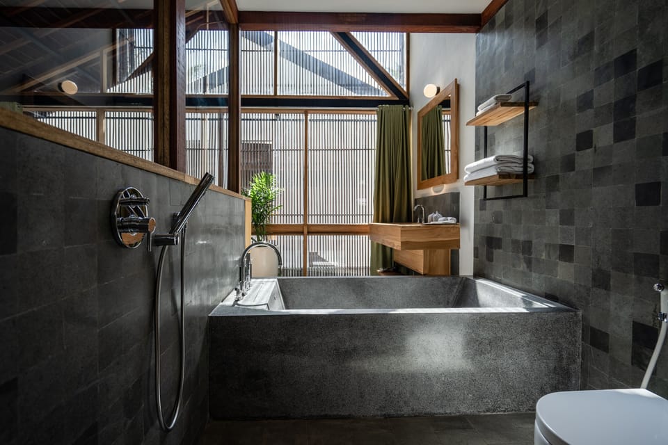 Separate tub and shower, rainfall showerhead, designer toiletries