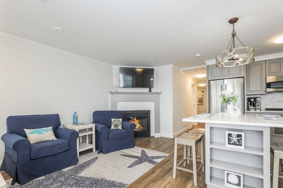 Open concept Kitchen living area, flat scene tv and gGas fire place - 405 Old Wharf Road-Dennisport Cape Cod- New England Vacation Rentals