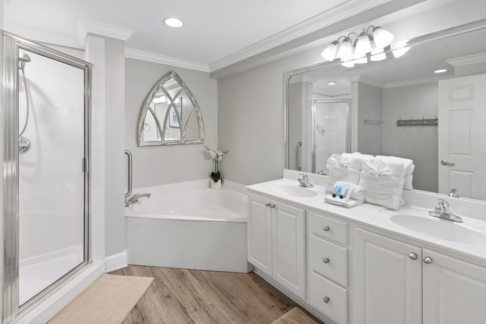 Relax in your spa-inspired bathroom with a soaking tub, dual vanities, and a spacious walk-in shower for a refreshing start to your day.