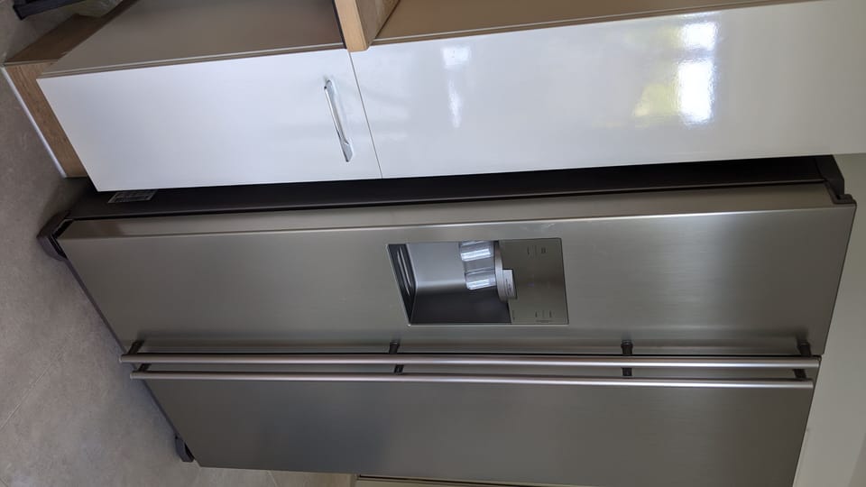 Side by side refrigerator, pull-out cupboard shelving with dishwasher plus more