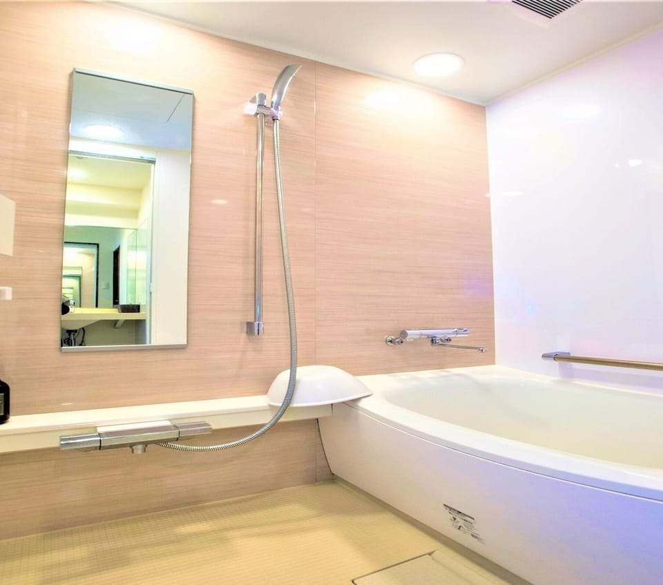 Twin room has separate bath and toilet.