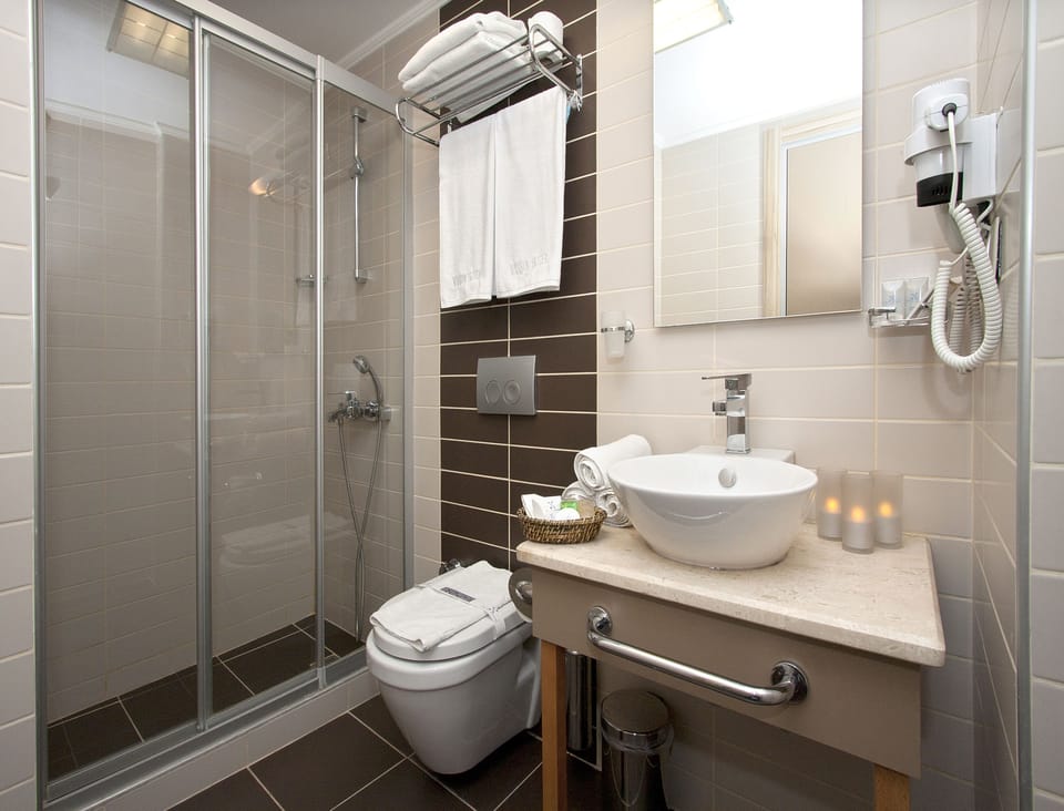 Shower, free toiletries, hair dryer, slippers