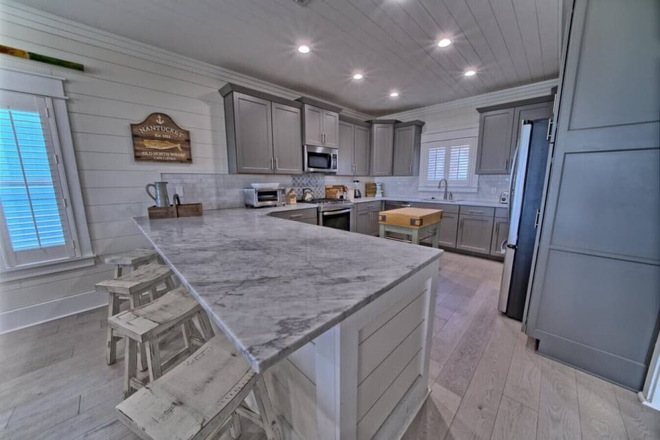 A chef`s dream: this fully equipped kitchen features premium appliances and ample space for preparing family meals.
