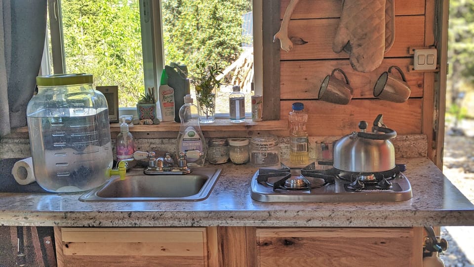 little kitchen - propane cook stove, cooler, clean drinking water. 