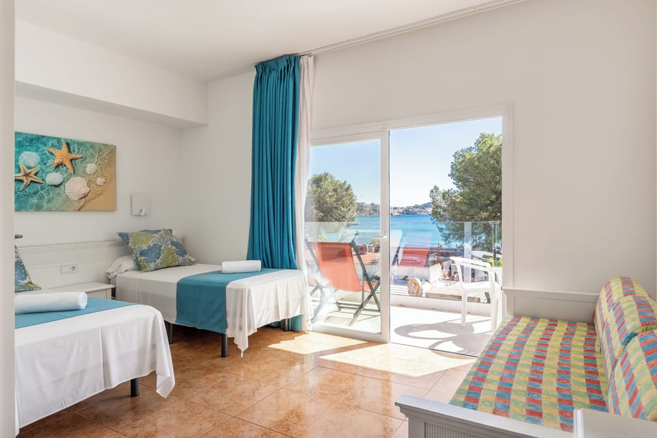 Family Room, Balcony, Sea View | Minibar, desk, blackout drapes, free WiFi