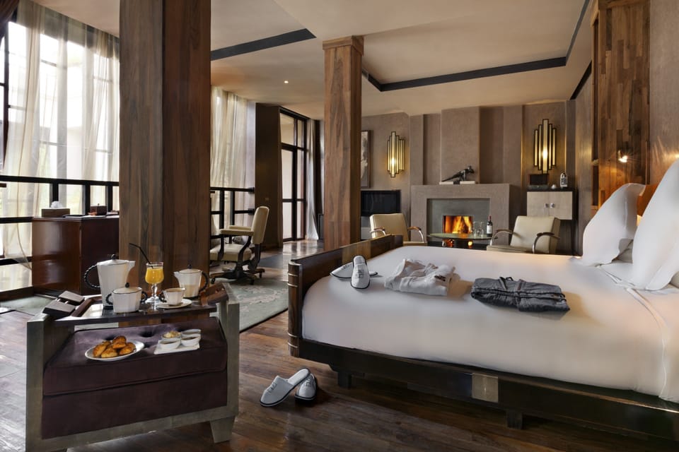 Luxury Suite, 1 King Bed, Fireplace | Premium bedding, minibar, in-room safe, individually decorated