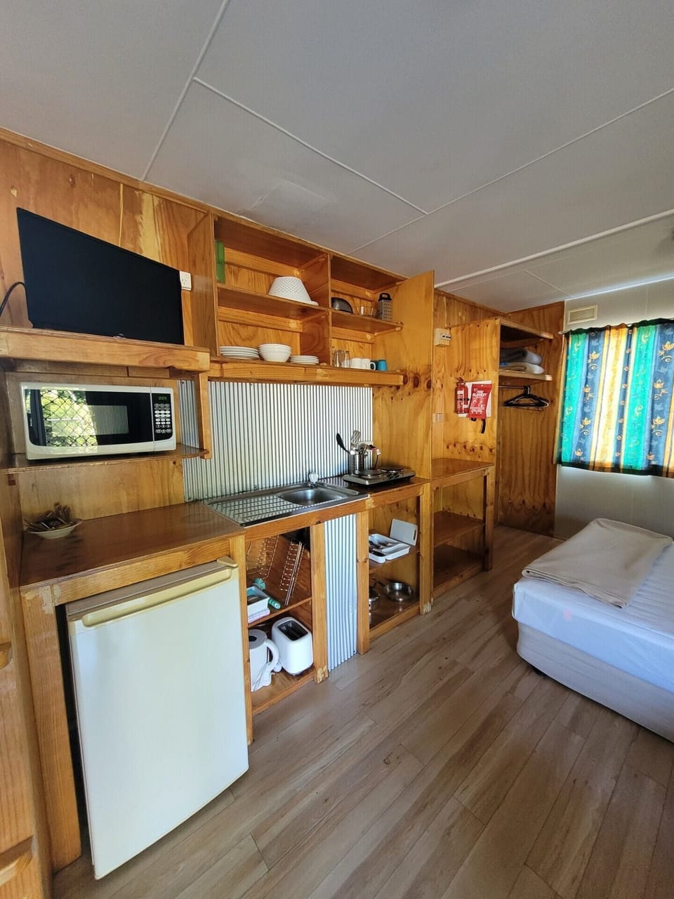 Basic Studio, Multiple Beds | Private kitchen | Full-size fridge, microwave, stovetop, electric kettle