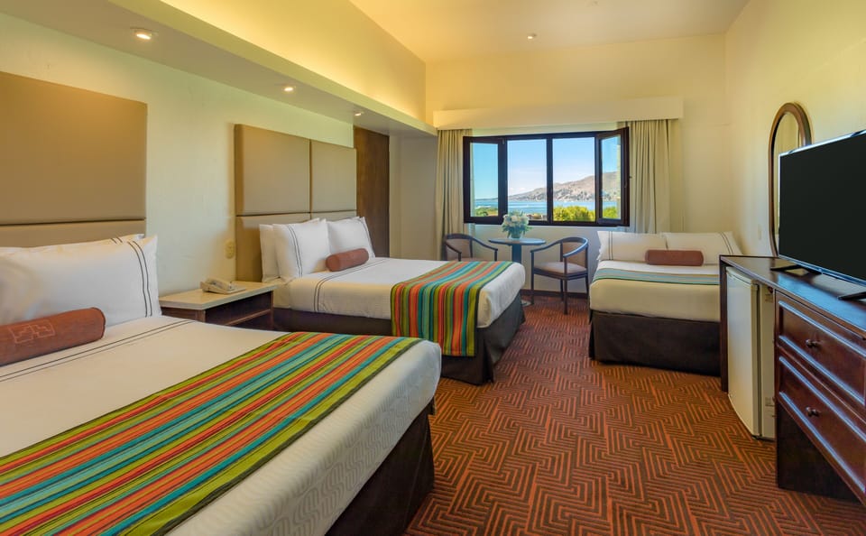 Premium bedding, down comforters, minibar, in-room safe