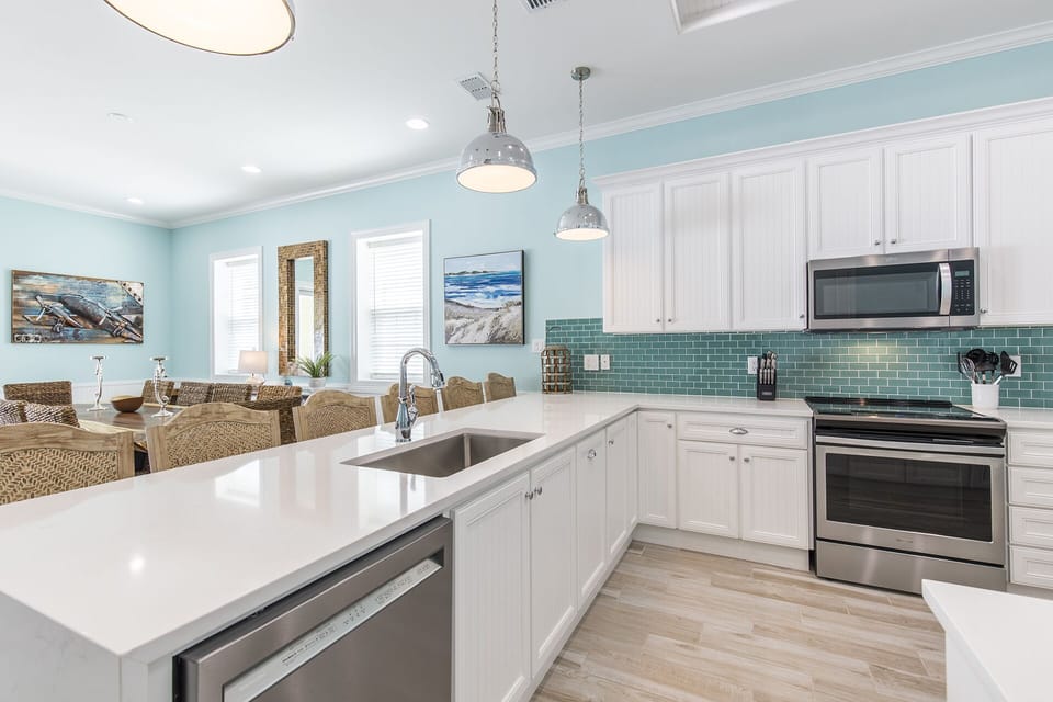 Bright, fully equipped kitchen with generous counter space and modern finishes.
