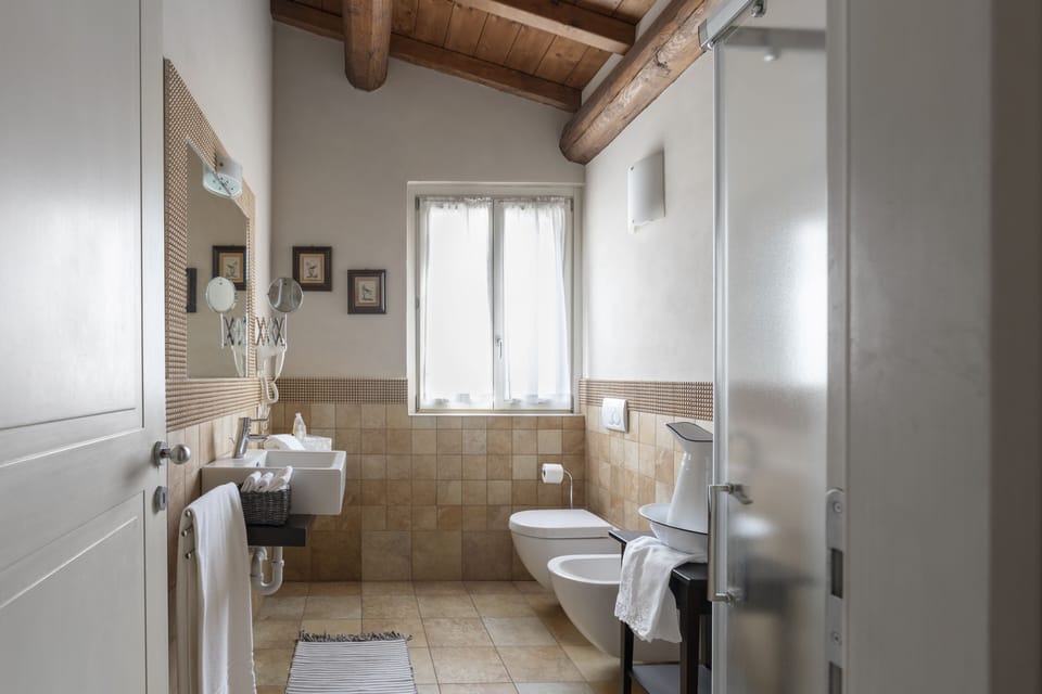 Deluxe Apartment, 1 Bedroom, Hill View (La Terrazza) | Bathroom | Shower, hair dryer, children's robes, bidet