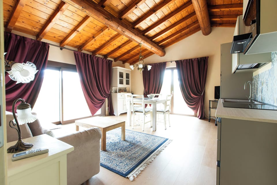 Deluxe Apartment, 1 Bedroom, Hill View (La Terrazza) | Living area | 32-inch flat-screen TV with satellite channels, TV, toys