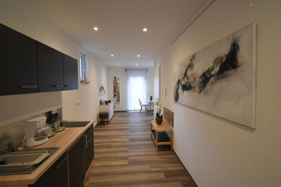Design Apartment | Private kitchenette | Fridge, microwave, stovetop, cookware/dishes/utensils