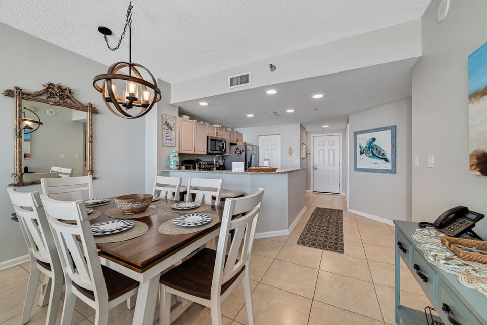 Flexible dining options for every occasion. Enjoy a formal meal at the dining table or a casual snack at the breakfast bar, seamlessly connected to the fully equipped kitchen.
