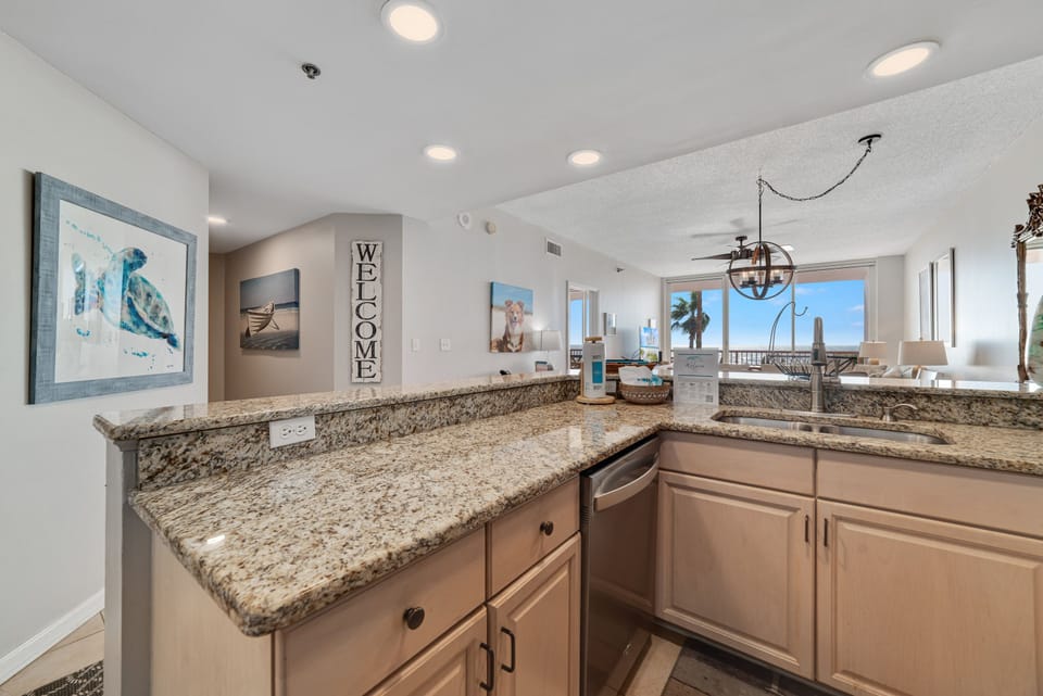 A tidy and functional kitchen countertop. This organized space, complete with coffee makers, a toaster, and a paper towel holder, makes everyday tasks a breeze.