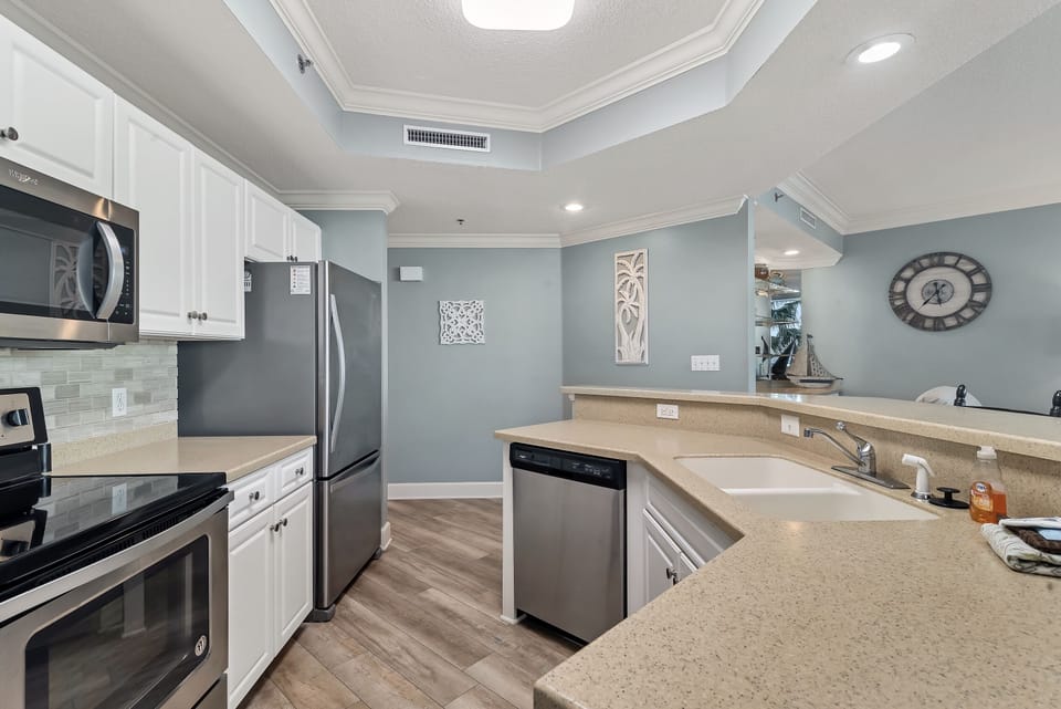 This updated kitchen features stunning granite countertops, sleek stainless steel appliances, and a spacious breakfast bar, making it the ideal spot for entertaining.