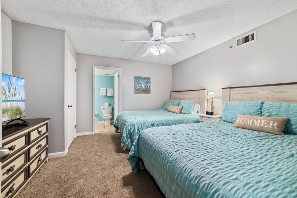 Perfect for families or groups! This comfortable guest room features two plush queen beds with crisp and fresh bedding, ensuring a restful night for everyone.