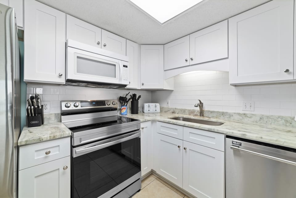 Fully Stocked & Ready. Enjoy the convenience of a modern kitchen complete with a full-size refrigerator, dishwasher, and all the small appliances (blender, toaster, coffee maker) for a comfortable stay.
