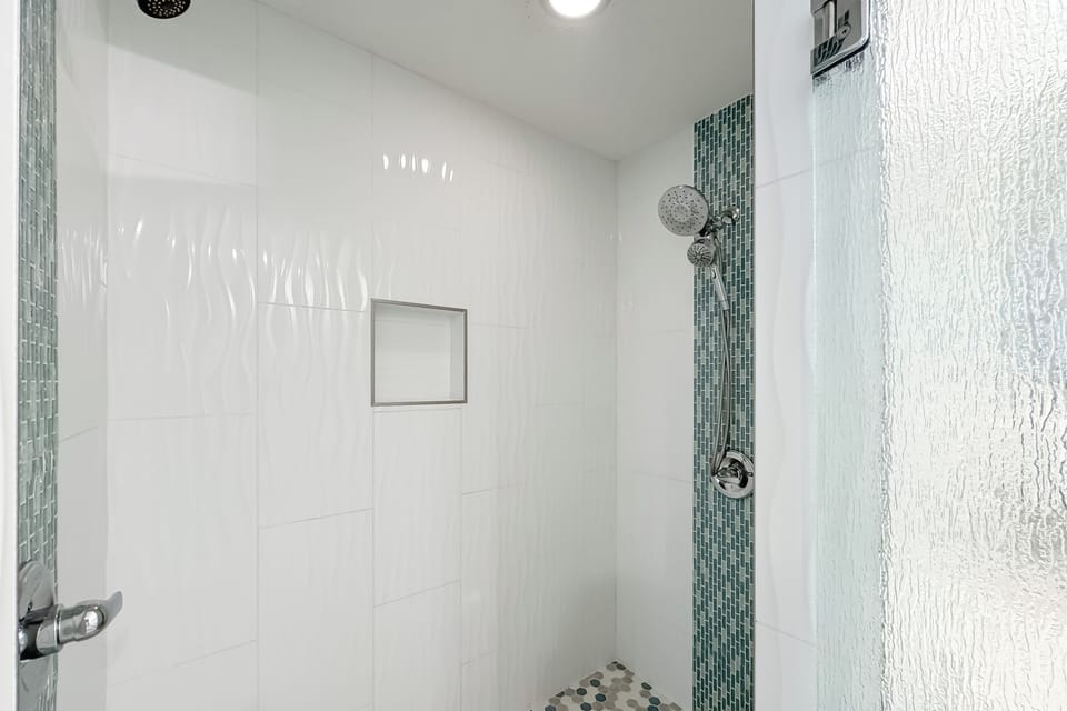 Modern updates meet classic comfort in this bathroom.  Clean lines and thoughtful design provide a relaxing experience.
